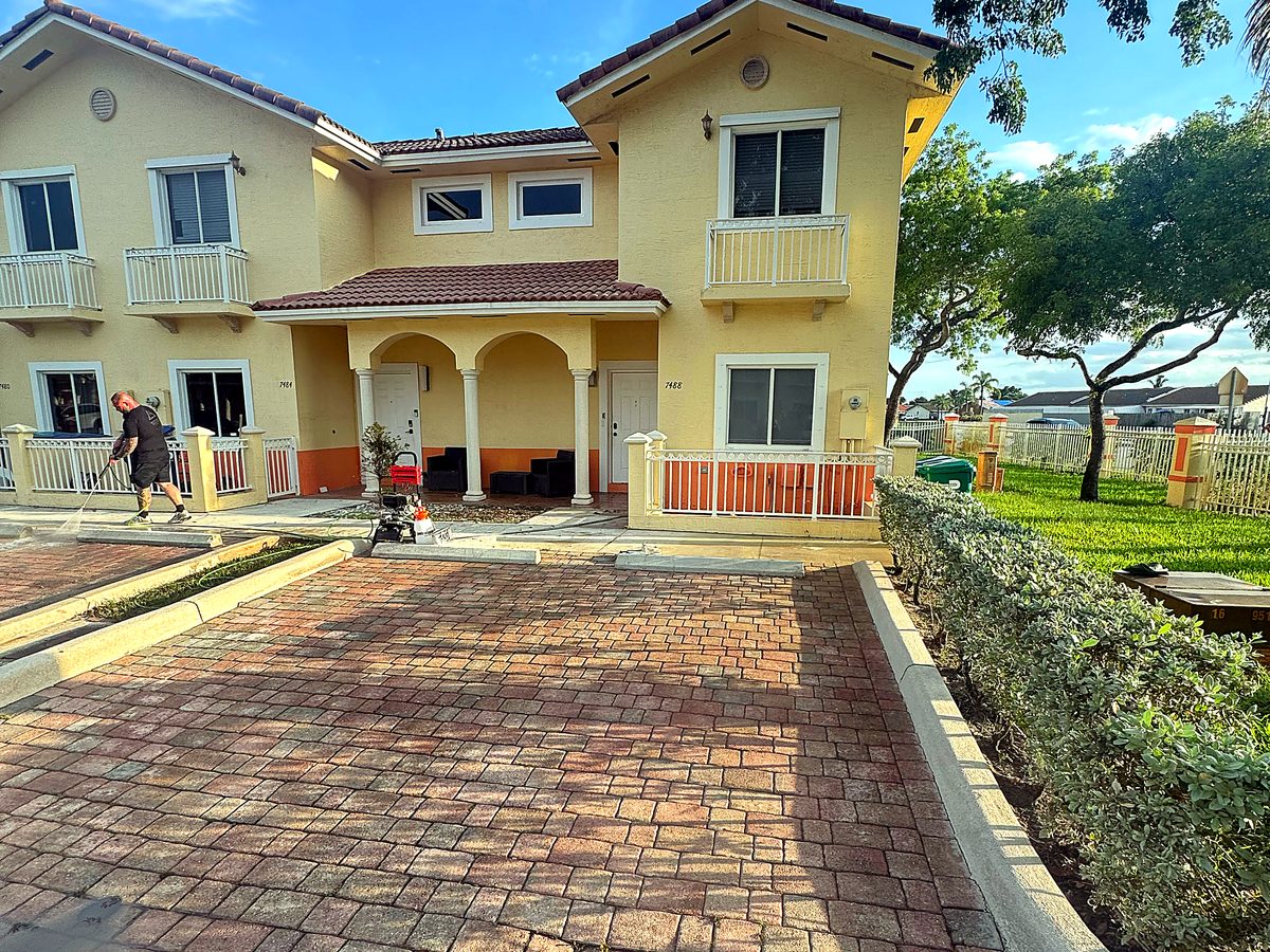 Freshly washed paver driveway in Miami